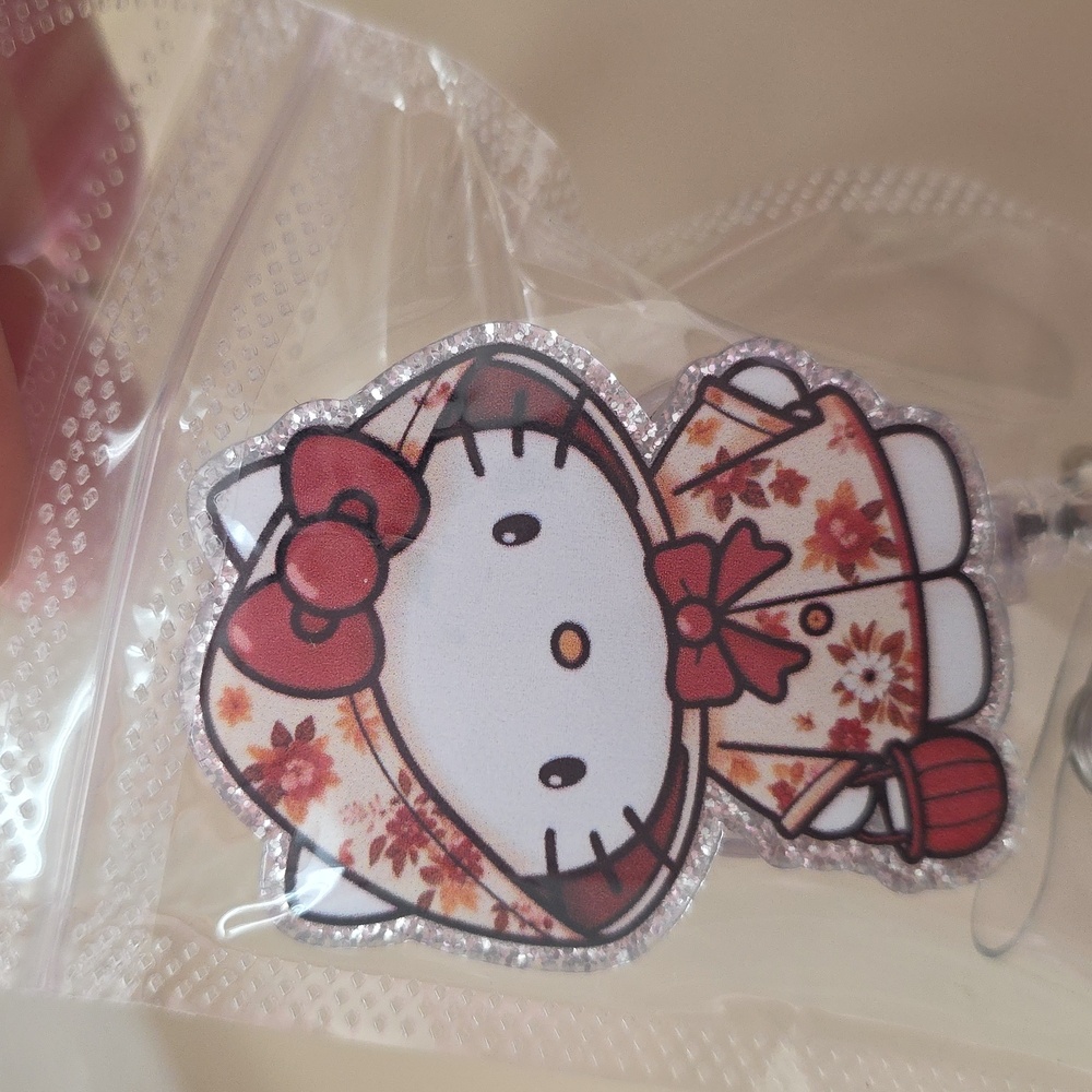 Hello kitty coat badge
